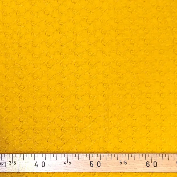 Tissu brodé jaune