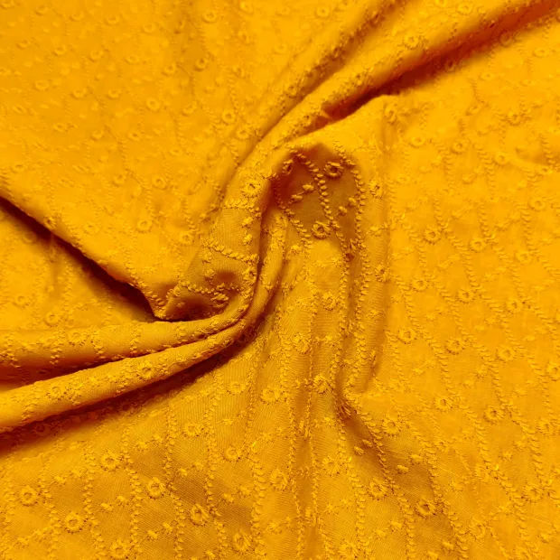 Tissu brodé jaune